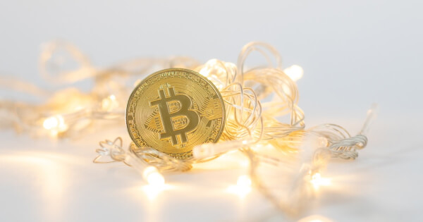 Bitcoin surrounded by decorating lights